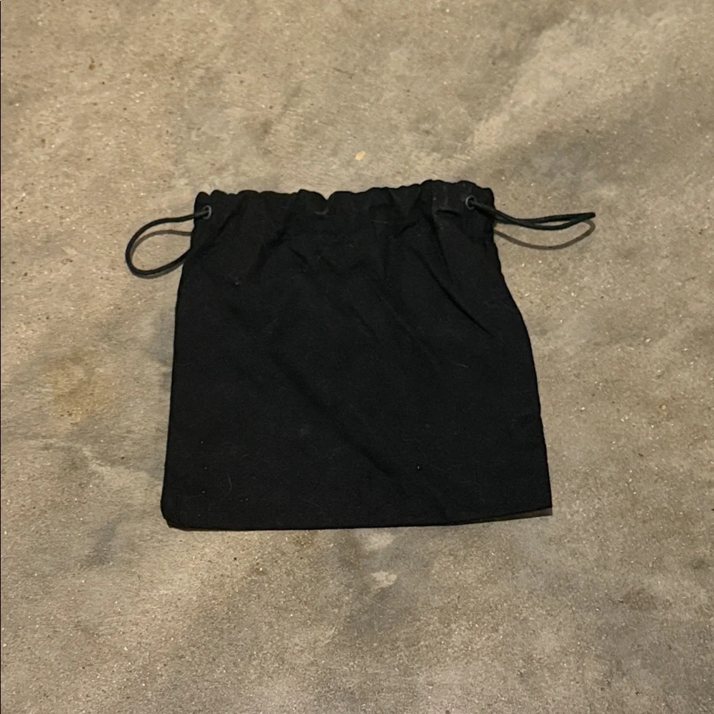 Authentic CHANEL Black Drawstring Pouch with White Logo